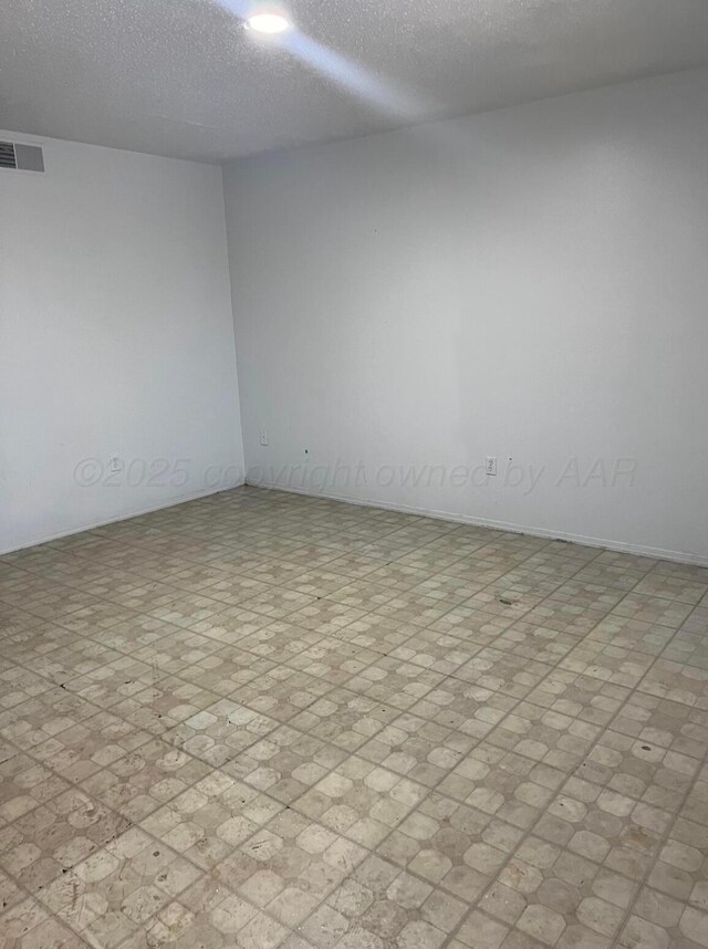 bedroom with dark wood-type flooring and a textured ceiling