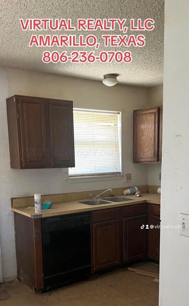 bathroom featuring toilet, vanity, and a textured ceiling