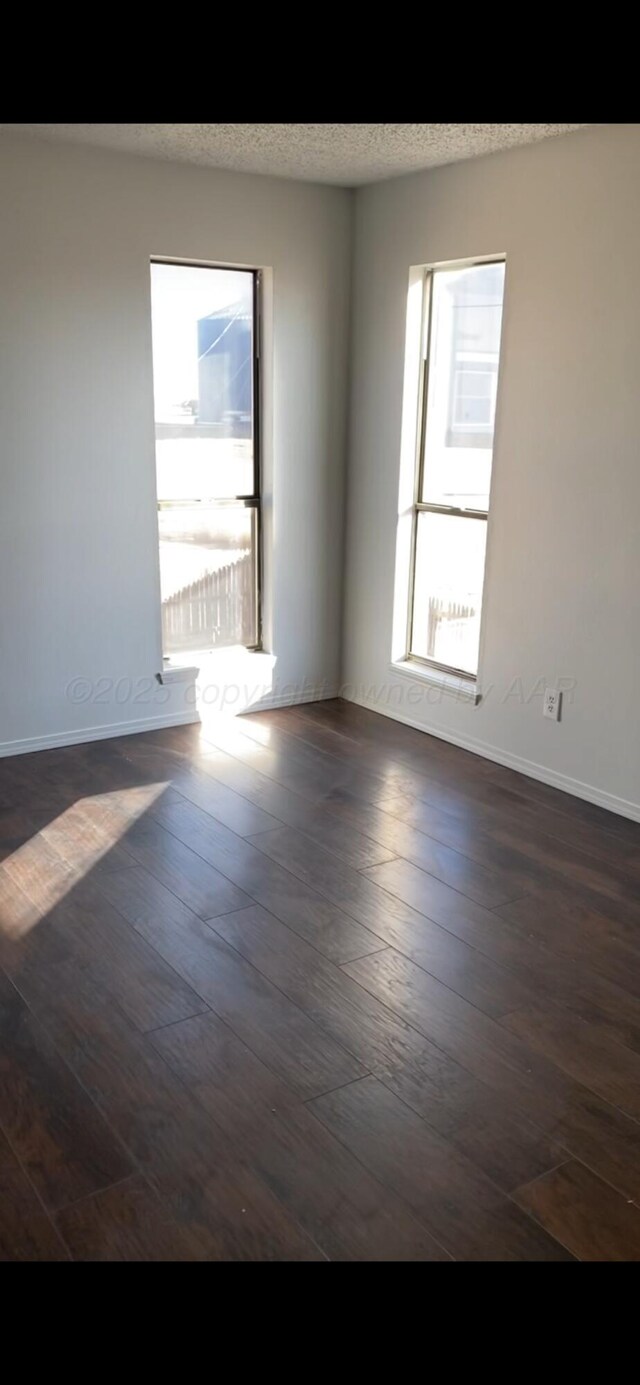 kitchen with sink, dark hardwood / wood-style floors, a textured ceiling, white refrigerator, and stainless steel range