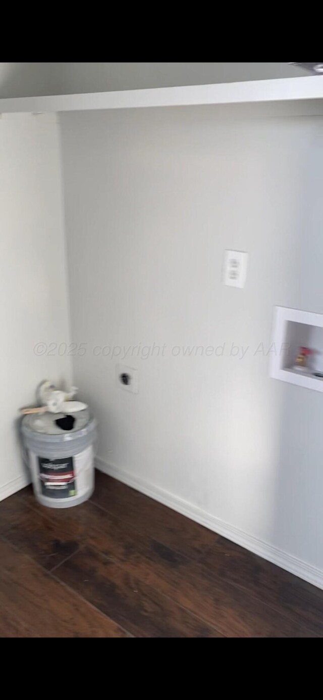 washroom with cabinets, washer hookup, gas water heater, and hookup for an electric dryer