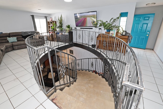 staircase with tile patterned floors