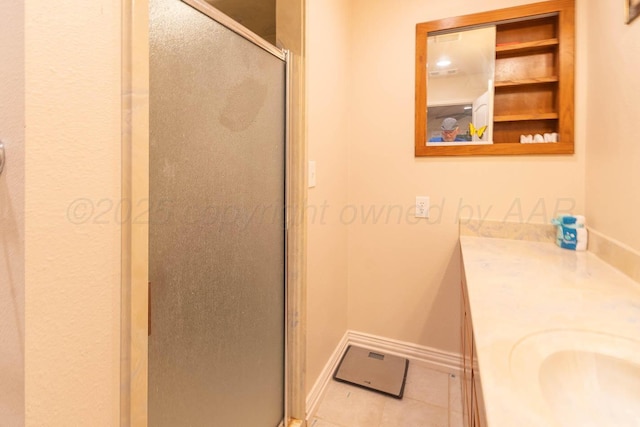 2108 Dakota Trl, Amarillo, TX 79118 - bathroom with a stall shower, baseboards, tile patterned floors, and vanity