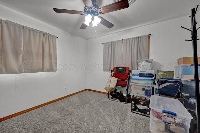 interior space featuring ceiling fan and baseboards