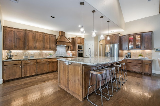 kitchen with stainless steel appliances, dark wood-type flooring, a sink, and custom exhaust hood