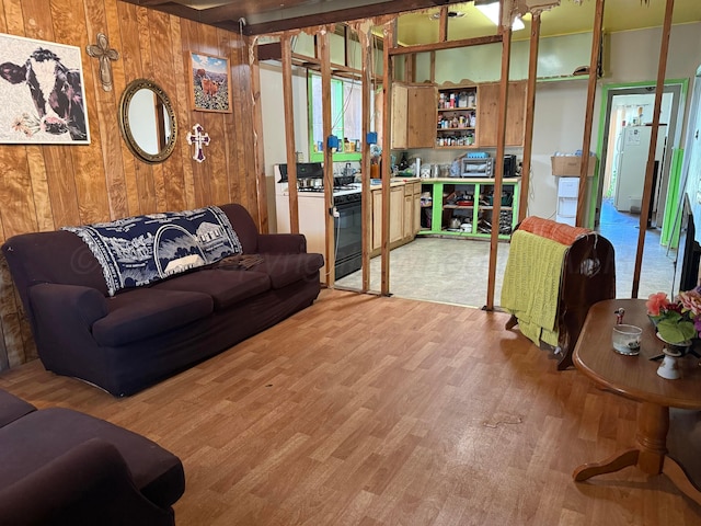 2107 Hemlock St, Borger, TX 79007 - living room featuring light wood-type flooring and wood walls