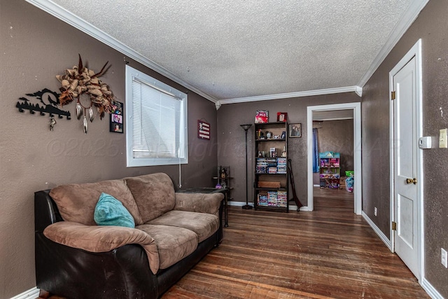 sitting room with wood finished floors, a textured wall, and ornamental molding