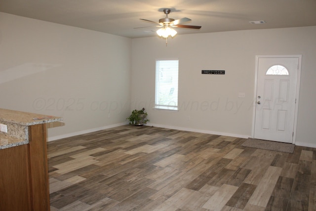 foyer featuring dark hardwood / wood-style floors and ceiling fan