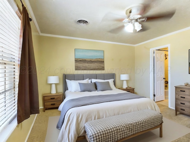 carpeted bedroom featuring ceiling fan and crown molding