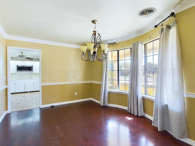 unfurnished room with a notable chandelier, wood-type flooring, and ornamental molding