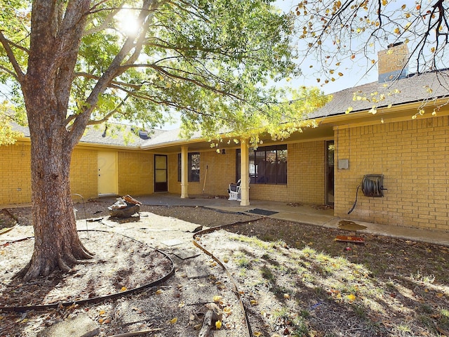 rear view of house featuring a patio