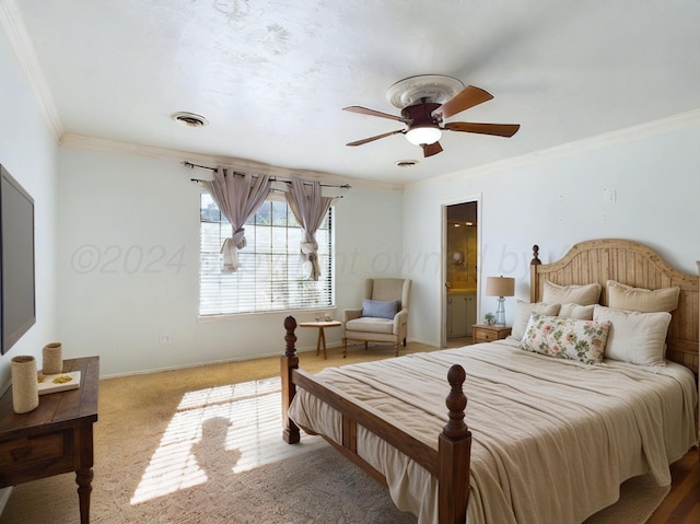 bedroom with carpet flooring, ensuite bathroom, ceiling fan, and crown molding