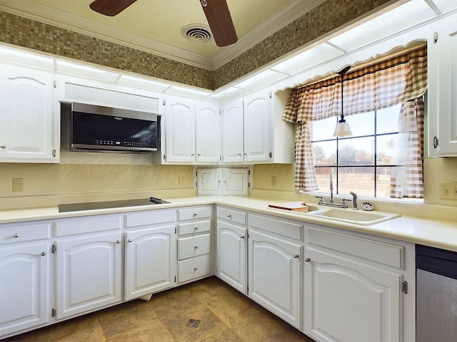 kitchen featuring sink, white cabinets, ornamental molding, and appliances with stainless steel finishes