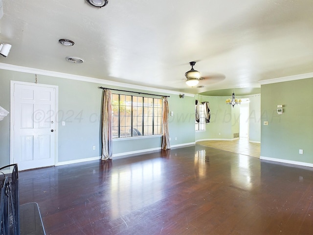 unfurnished room with ceiling fan with notable chandelier, dark wood-type flooring, and crown molding