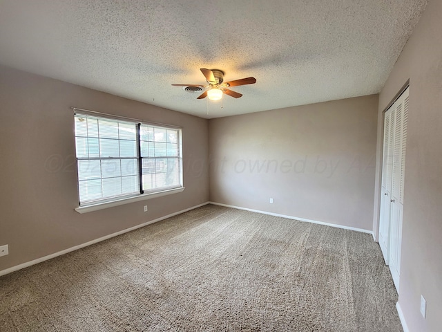 1312 Coffee St, Pampa, TX 79065 - carpeted empty room with ceiling fan and a textured ceiling