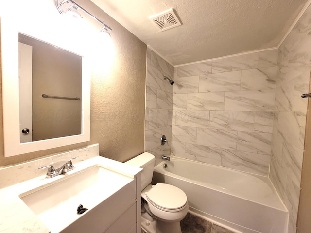 1312 Coffee St, Pampa, TX 79065 - full bathroom with a textured ceiling, vanity, toilet, and tiled shower / bath