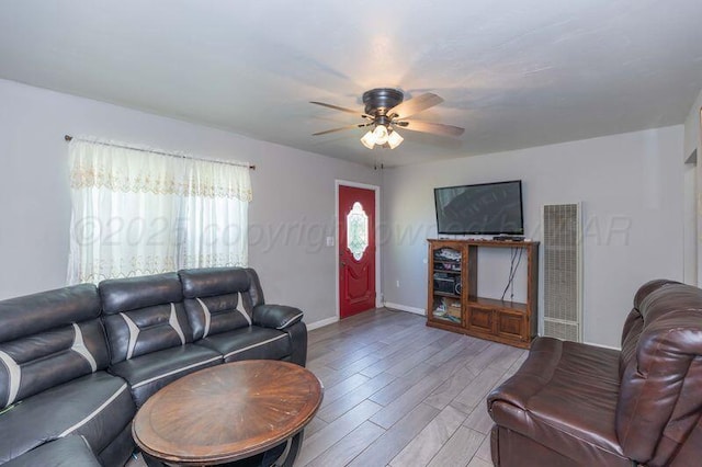 2503 SW 5th Ave, Amarillo, TX 79106 - living room featuring a heating unit, ceiling fan, and wood finished floors