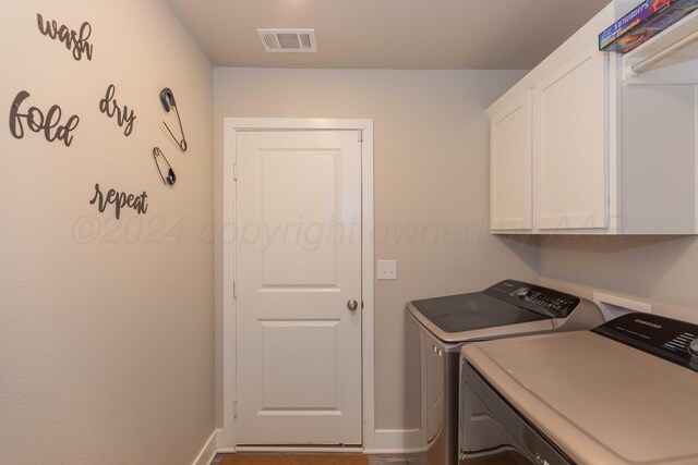 1738 Wesleyan St, Amarillo, TX 79118 - laundry room with cabinets and independent washer and dryer