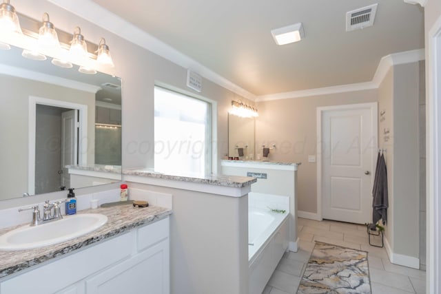 1738 Wesleyan St, Amarillo, TX 79118 - bathroom with ornamental molding, tile patterned flooring, vanity, and a relaxing tiled tub