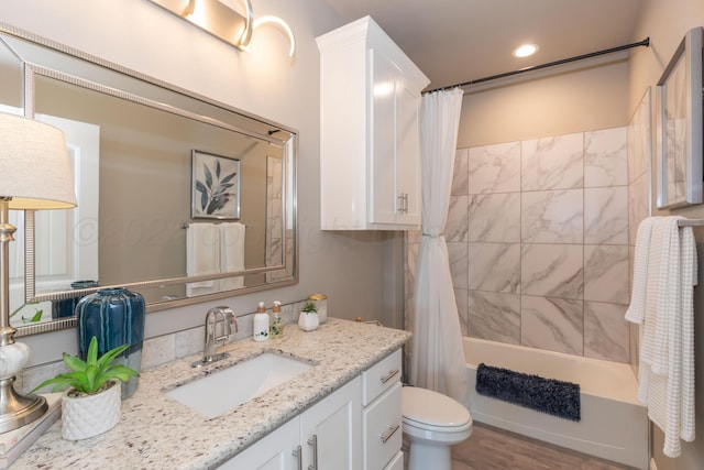6900 Tatum Cir, Amarillo, TX 79119 - bathroom featuring vanity, shower / bath combo, recessed lighting, and wood finished floors
