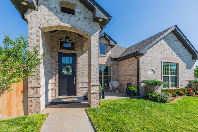 6900 Tatum Cir, Amarillo, TX 79119 - doorway to property with brick siding and a patio