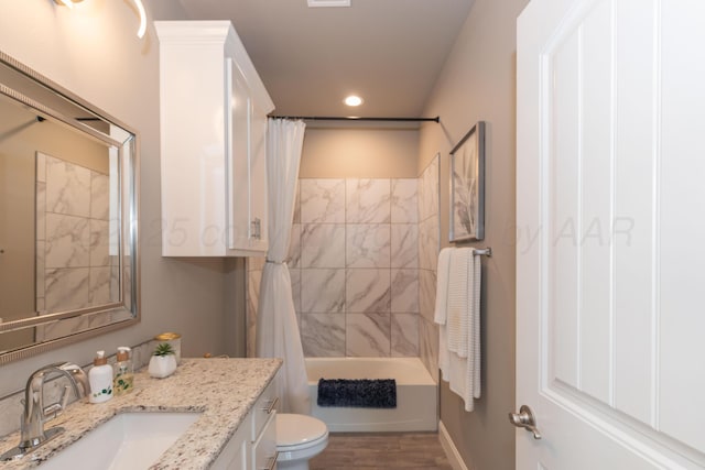 6900 Tatum Cir, Amarillo, TX 79119 - bathroom featuring vanity, recessed lighting, shower / bath combo, and wood finished floors