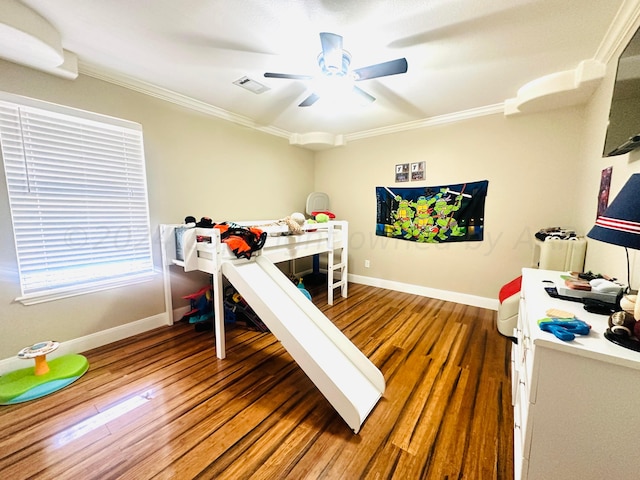 bedroom featuring ceiling fan, wood-type flooring, and crown molding
