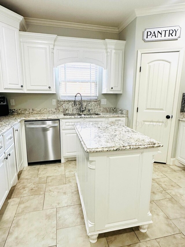 kitchen featuring white cabinets, dishwasher, and a kitchen island