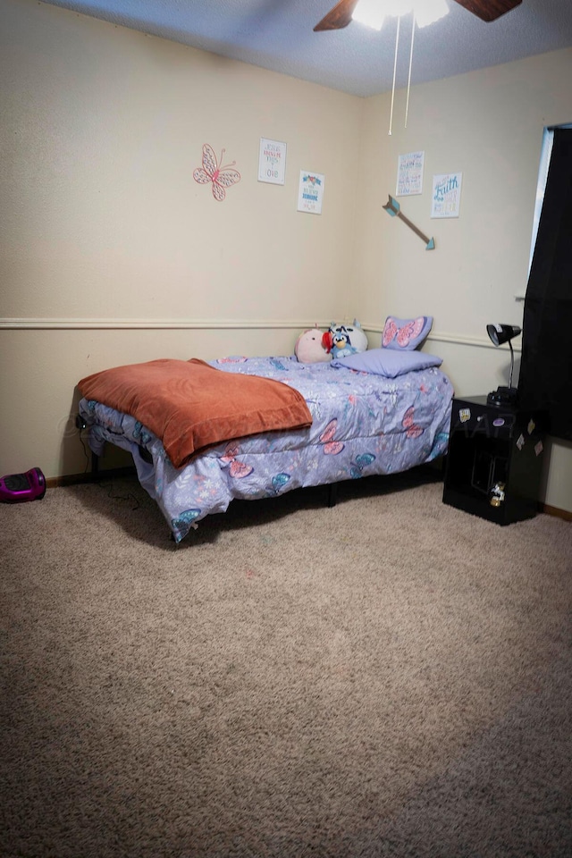 bedroom featuring ceiling fan and carpet flooring