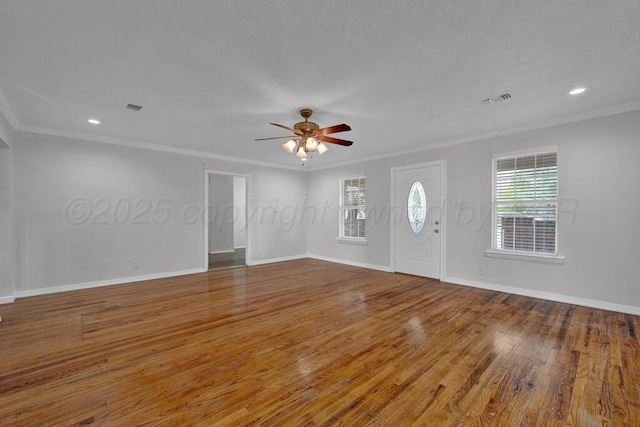 foyer entrance with wood finished floors, ceiling fan, baseboards, crown molding, and recessed lighting