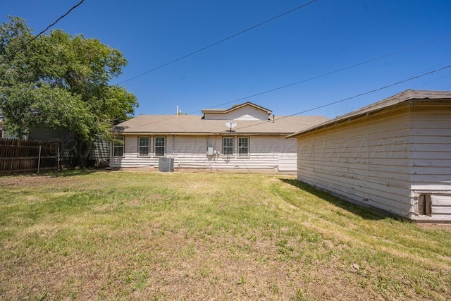 rear view of house with cooling unit