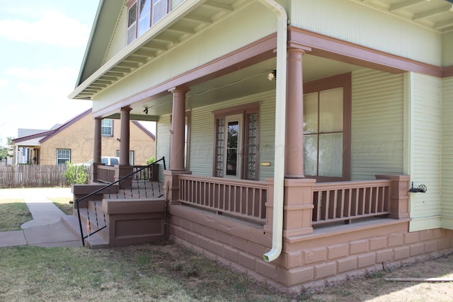 property entrance with covered porch