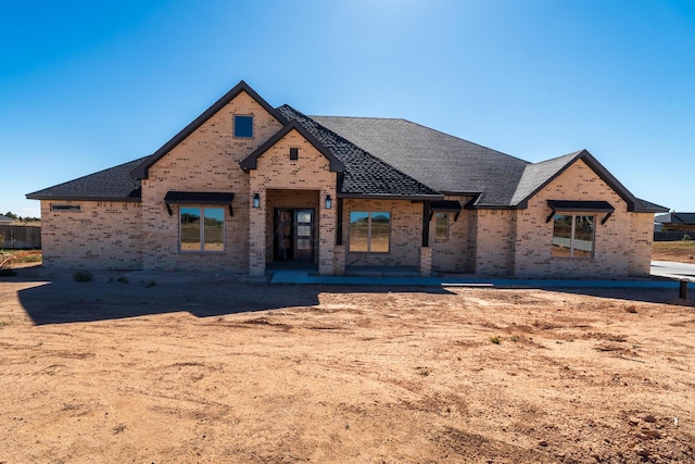 property under construction featuring a patio