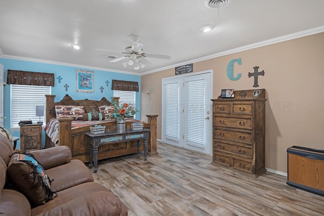 living room with ceiling fan, light wood-type flooring, and ornamental molding