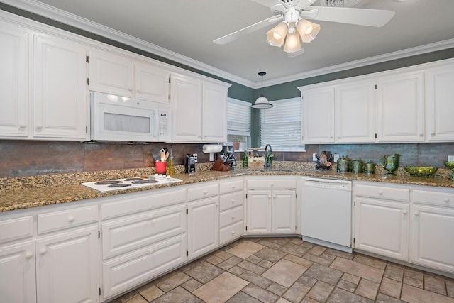 kitchen with sink, decorative backsplash, white appliances, and white cabinetry