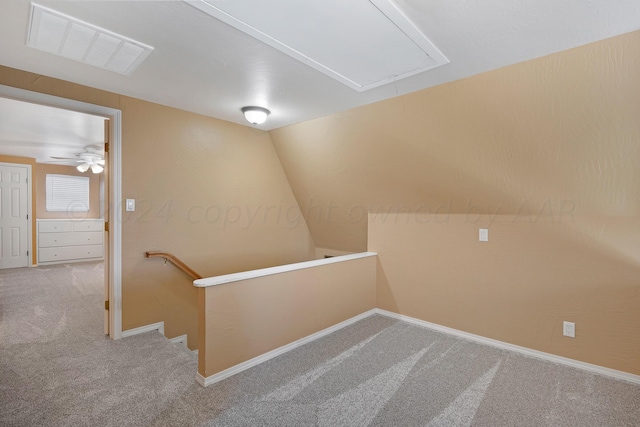 interior space with vaulted ceiling and carpet