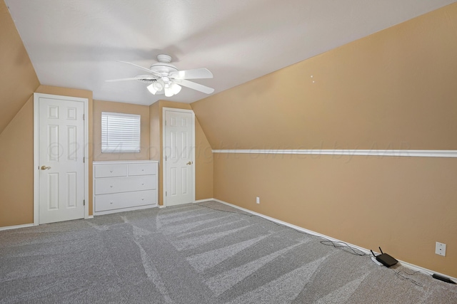 bonus room with lofted ceiling, carpet flooring, and ceiling fan