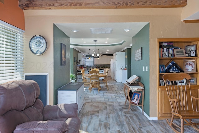 living room featuring light wood-type flooring and ceiling fan