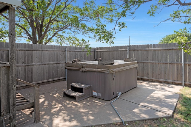 view of patio / terrace featuring a hot tub