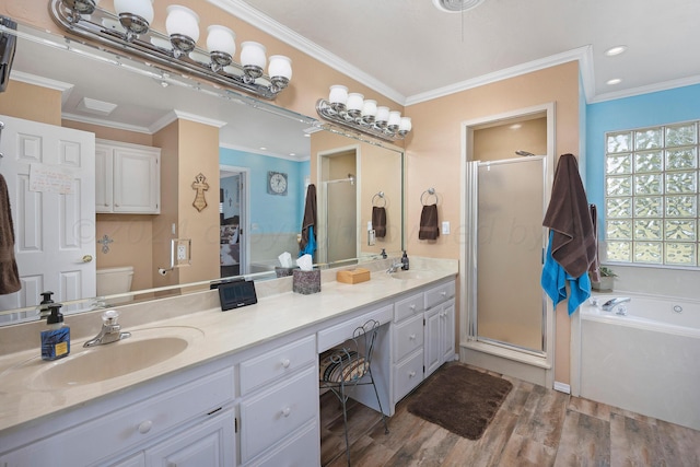 full bathroom featuring toilet, independent shower and bath, ornamental molding, wood-type flooring, and vanity