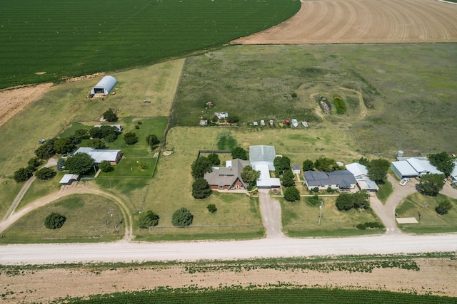 birds eye view of property with a rural view