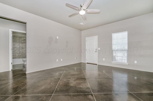 303 Loesh St, Amarillo, TX 79118 - empty room with a ceiling fan and concrete floors
