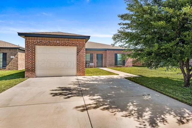 303 Loesh St, Amarillo, TX 79118 - view of front of house with concrete driveway, brick siding, a front yard, and an attached garage