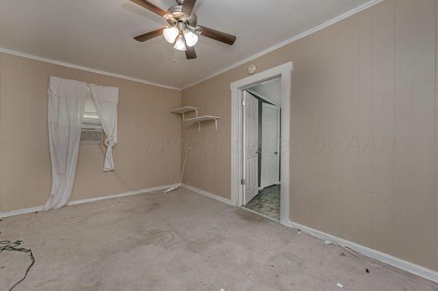 504 High St, Claude, TX 79019 - unfurnished bedroom featuring carpet floors, ornamental molding, baseboards, a ceiling fan, and wood walls
