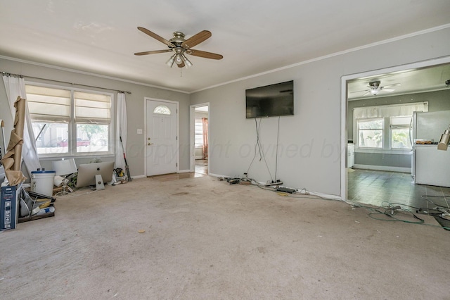 504 High St, Claude, TX 79019 - unfurnished living room with a ceiling fan, carpet floors, and ornamental molding