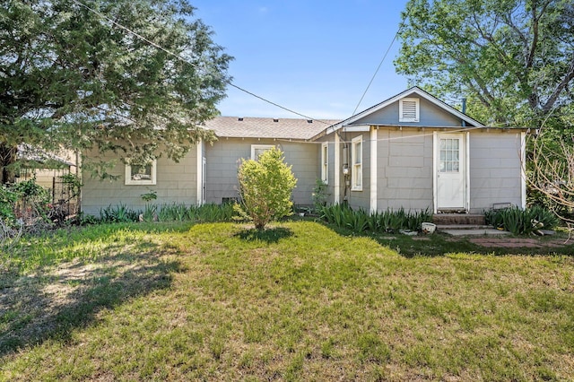 504 High St, Claude, TX 79019 - rear view of property with a lawn and entry steps