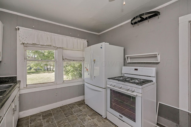 504 High St, Claude, TX 79019 - kitchen featuring white appliances, wood walls, a sink, baseboards, and ornamental molding