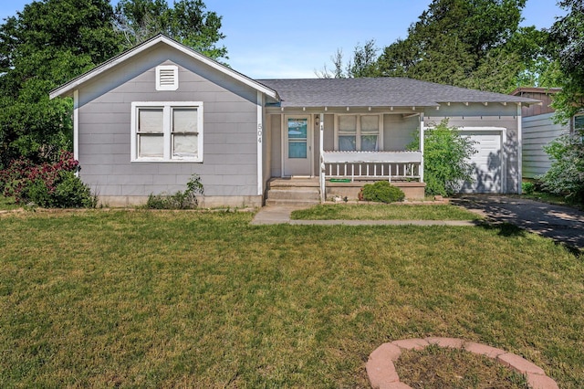 504 High St, Claude, TX 79019 - single story home with a porch, a garage, roof with shingles, a front lawn, and driveway
