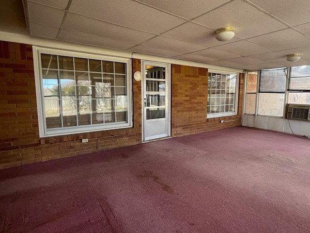 exterior space featuring a paneled ceiling and cooling unit