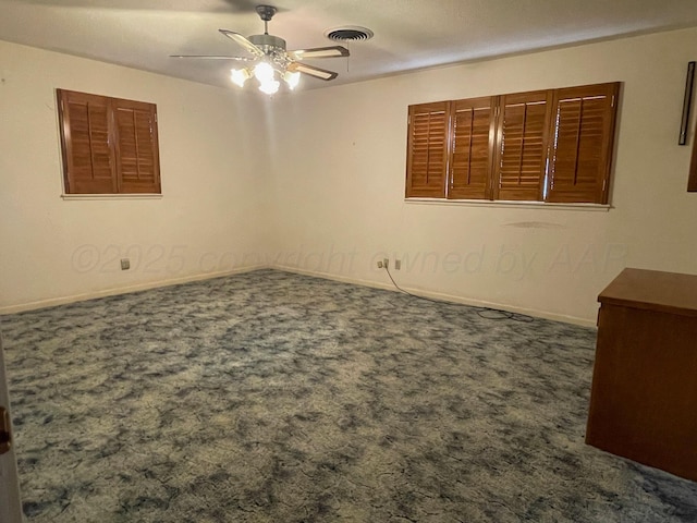 spare room with carpet flooring and ceiling fan