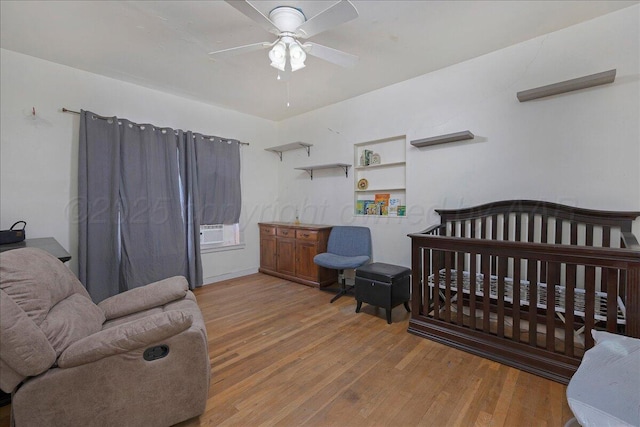 bedroom with ceiling fan and wood finished floors